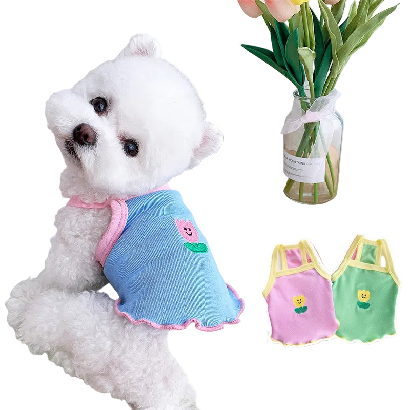 Small dog wearing a blue lightweight summer dress in a side view, showcasing the sheer breathable fabric and slim-fit design