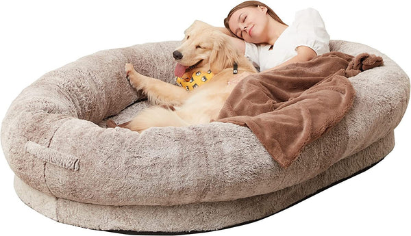 Dog and owner relaxing together on the Paws For Royalty luxury human dog bed designed for comfortable shared lounging and cuddles