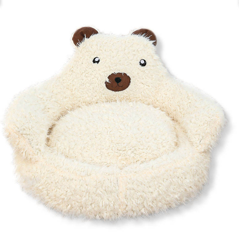 Beige plush alpaca-inspired dog bed with a cozy donut shape, orthopedic cushioning, and supportive raised edges for small pets