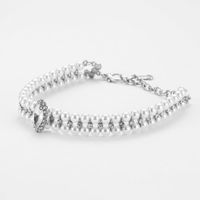 Side view of the Paws For Royalty Diamond Pearl Dog Collar, highlighting its sparkling rhinestones and elegant pearl details for small pets.