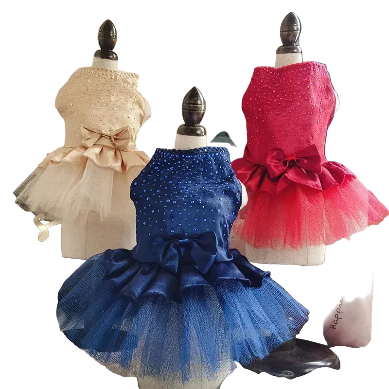 Polka dot dog dress available in beige, red, and pink colors for small breed dogs