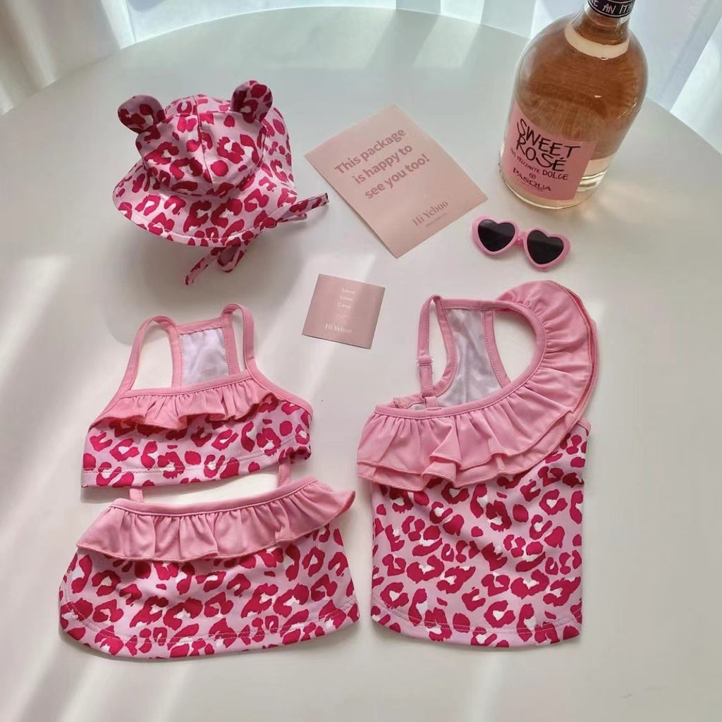Paws For Royalty pink dog bikini jumpsuit with a stylish one-piece design for small dogs at the beach or pool