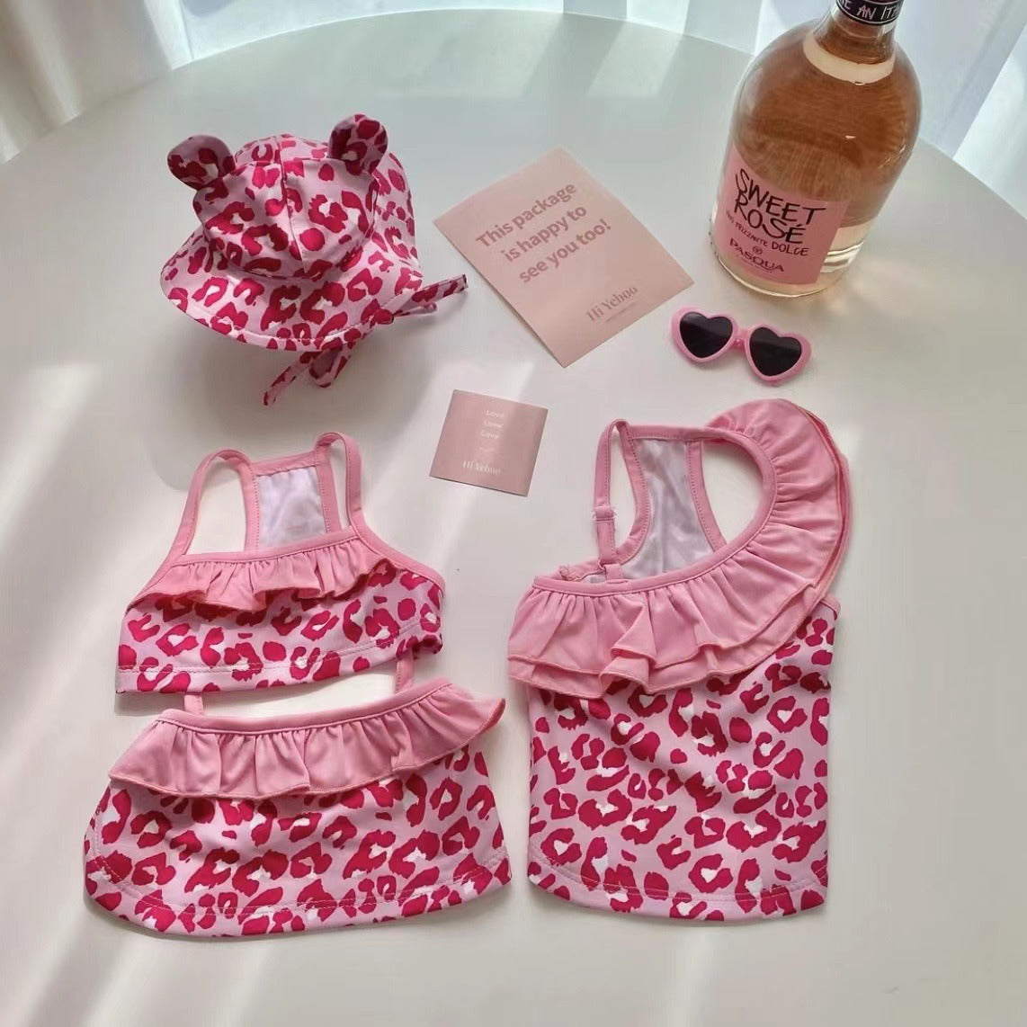 Paws For Royalty pink dog bikini jumpsuit with a stylish one-piece design for small dogs at the beach or pool
