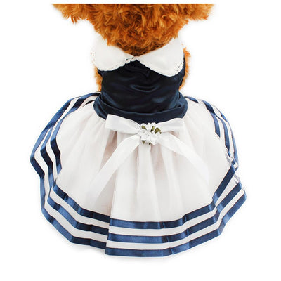 Small dog wearing the Paws For Royalty Dog Sailor Dress, featuring classic nautical stripes and an elegant lace tutu skirt for stylish boutique pet fashion.