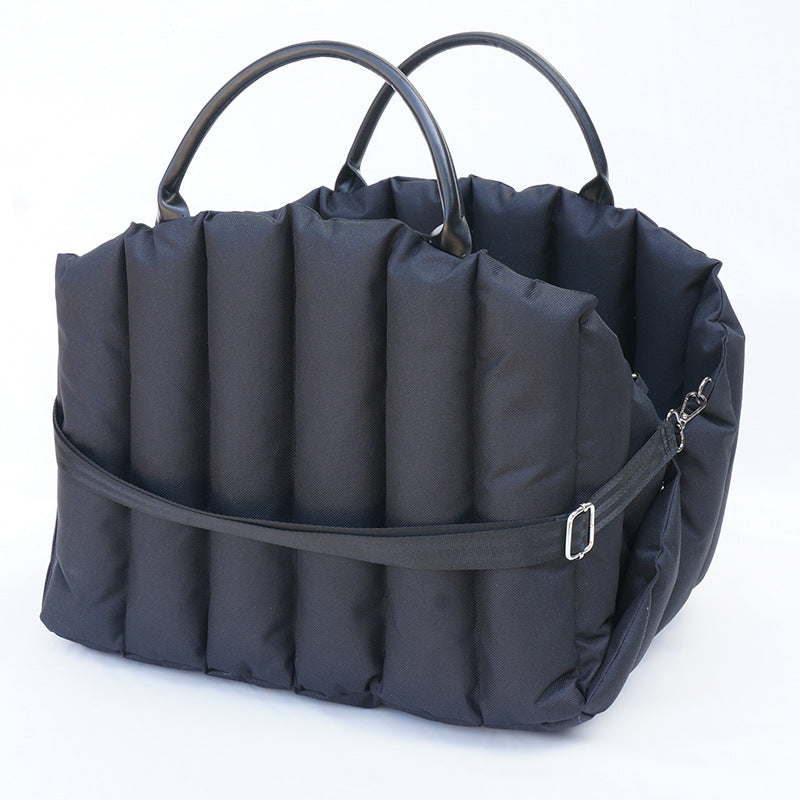 Black luxury dog carrier bag and travel bed designed for small dogs and cats, perfect for travel and everyday adventures