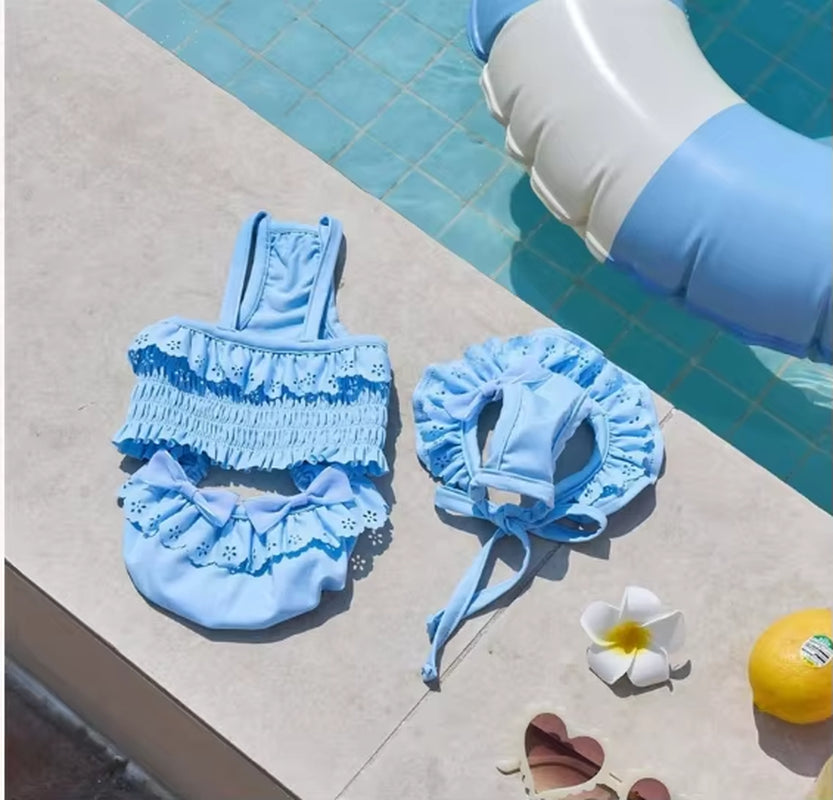 Blue dog swimsuit with matching swim cap for small dogs made with breathable quick-dry material