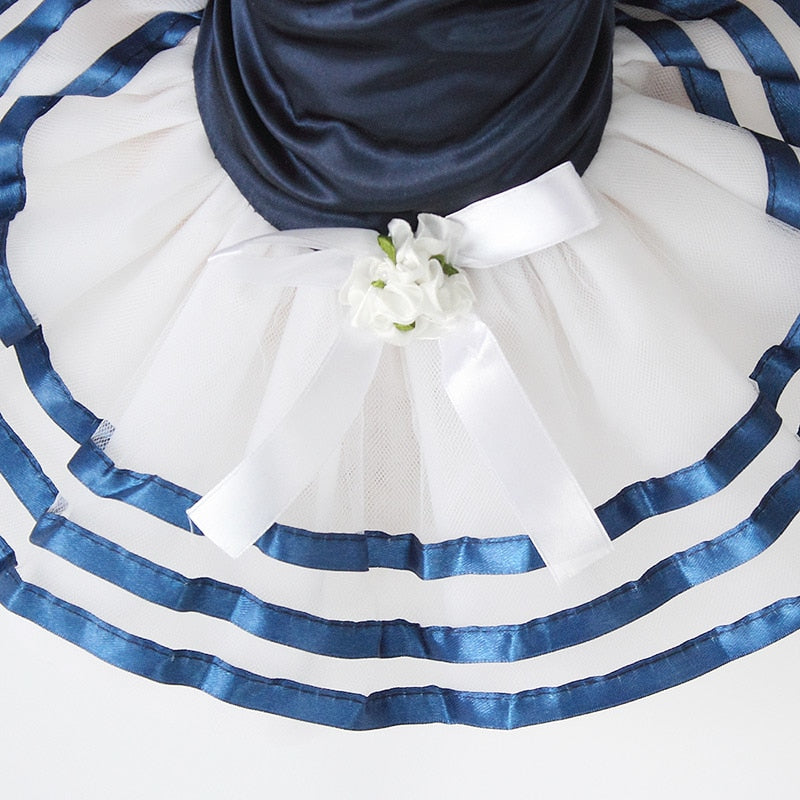 Close-up detail of the Paws For Royalty Dog Sailor Dress, showcasing the classic nautical sailor design, striped fabric, and elegant lace tutu skirt.
