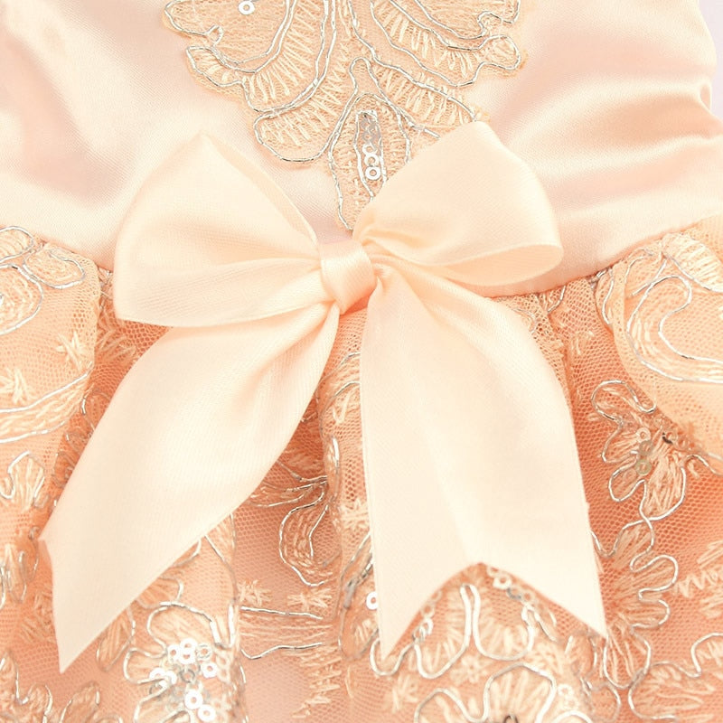 Close-up of the decorative ribbon on the Paws For Royalty Sequin Lace Dog Wedding Dress, highlighting the elegant details of this luxury princess dog gown.