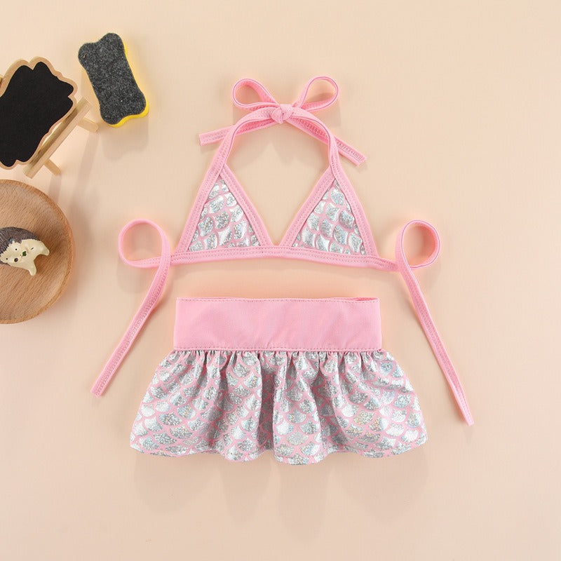 Pink dog bikini swimsuit designed for small dogs with playful summer styling, quick-dry fabric, and boutique-inspired details